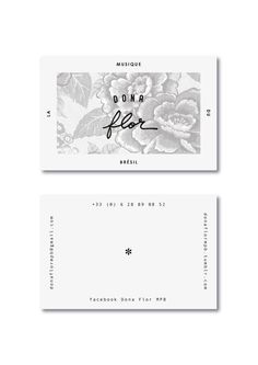 two business cards with flowers on them