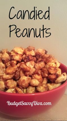 a red bowl filled with candied peanuts