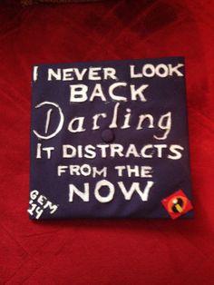 a graduation cap that says i never look back daring it distracts from the now