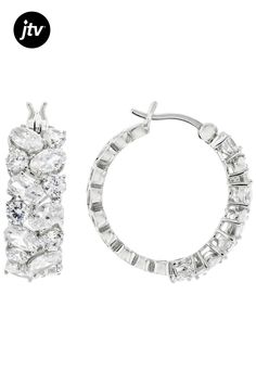 Bella Luce�� white diamond simulant 7.37ctw oval and round, rhodium over sterling silver hoops. Measures approximately 0.93" L x 0.30" W and has saddleback backings. The diamond equivalent weight is 4.47ctw. Oval Cubic Zirconia Hoop Earrings With Diamond Cut, Oval Cubic Zirconia Hoop Earrings Fine Jewelry, White Oval Hoop Earrings With Prong Setting, Modern Oval Cubic Zirconia Jewelry, White Oval Sterling Silver Hoop Earrings, Oval Diamond Cut Sterling Silver Hoop Earrings, Oval Sterling Silver Hoop Earrings With Diamond Cut, Silver Oval Hoop Earrings For Wedding, Silver Oval Hoop Earrings With Diamond Accents