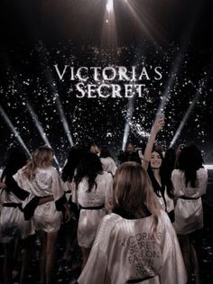 the victoria's secret show is being filmed on stage with many women in white dresses