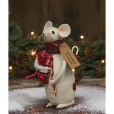 a small white mouse with a red scarf on it's head and a tag in its hand