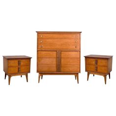 three pieces of furniture including a dresser and two nightstands, all in solid wood