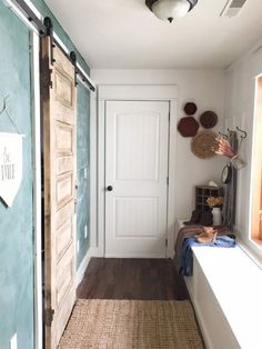 the hallway is clean and ready to be used as a mudroom for laundry or other things