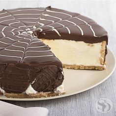 a chocolate and white cheesecake on a plate