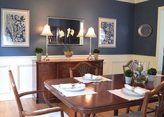 the dining room table is set with place settings for four people to sit at it