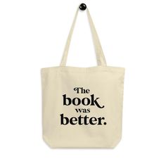 the book was better tote bag with black lettering on it, which reads'the book was better '