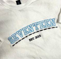 Hi Carats, super excited to offer this new seventeen design. I wanted to show a cute new design that carats can enjoy. This design includes the seventeen name outline, member's initials, and year of group establishment. You can choose to buy this design on a hoodie, crewneck, or t-shirt. This apparel would be super cute to use when going to run errands, going to a concert, or even to take to class :) !! Hope you enjoy it.  seventeen clothes , kpop gift , carat fan apparel , carat gift, seventeen  *embroidered design on the front **Design on the front chest is all embroidered Features T-shirt * 5.3 oz., 100% preshrunk cotton * Sport Grey are 90% cotton, 10% polyester * Classic midweight fabric * Classic fit tubular body * 7/8" collar * Tear-away label Crewneck * 8 oz., 50% cotton, 50% polye Seventeen Shirt Design, Sporty T-shirt With Custom Embroidery, Sporty Custom Embroidery T-shirt For Streetwear, Trendy Custom Embroidery Tops For Streetwear, Seventeen Tshirt Design, Kpop Shirts Design, Class Shirt Ideas, Seventeen Clothes, Seventeen Hoodie