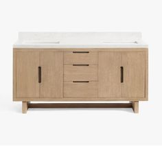 a white sink sitting on top of a wooden cabinet