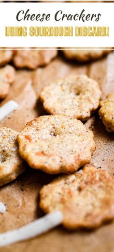 some crackers sitting on top of a piece of paper with toothpicks sticking out of them