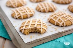 iced cookies with icing on a baking sheet