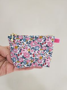 "100% Cotton. Lightweight. From the world famous Liberty Fabrics with a silk-like touch, unique print quality and striking color vibrancy. This mini pouch is great size for a couple of small items. Size is 4\"W / 3\"H / 1.5\"D (10cm / 8cm / 3.5cm) Flat bottom shape. Fabric is Liberty of London Tana Lawn. The pouch opens with golden color zipper.(High quality YKK zipper) It comes with a velvet ribbon on one side.(color is pink) Lined inside with pretty baby-pink color cotton. Please, Hand wash. O Multicolor Cosmetic Bag With Zipper Closure As Gift, Multicolor Zipper Pouch As A Gift, Cute Multicolor Cosmetic Bag As Gift, Cute Multicolor Cosmetic Bag Gift, Cute Multicolor Cosmetic Bag With Zipper Pouch, Cute Multicolor Cosmetic Bag With Removable Pouch, Pink Floral Print Pouch Bag, Trendy Multicolor Zipper Coin Purse, Cute Multicolor Pouch With Removable Pouch