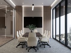 a conference room with white chairs and a large table