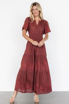 Our Kennedy Embroidered Maxi Dress is the perfect blend of casual and cute. You'll love the subtle detailing that makes it stand out, including a notched V-neckline and white embroidered floral pattern. Baltic Born Dress, Cocktail Jumpsuit, Dark Sage, Baltic Born, Personal Style Inspiration, Tiered Maxi Skirt, Guest Attire, Embroidered Maxi Dress, Family Photo Outfits