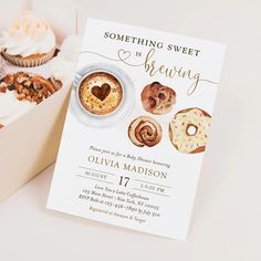 there is a box of cupcakes and a card with the message something sweet is for sharing