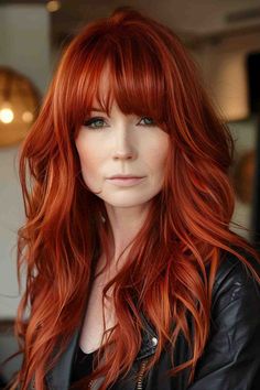 Woman with vibrant copper red hair and full straight-across bangs Bangs With Copper Hair, Red Hair For 40 Year Old Women, Long Red Layered Hair, Red Hair With Bangs And Layers, Red Hair Extensions Before And After, Shoulder Length Red Hair With Layers, Red Shag Haircut, Shaggy Red Hair