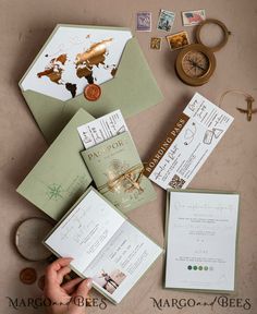 the wedding stationery is laid out on top of the table, including an envelope and other items