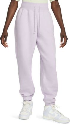 Nike Sweatpants With Elastic Waistband For Spring, Nike Solid Color Athleisure Sweats, Nike Athleisure Sweats, Nike Solid Color Athleisure Sweatpants, Nike Solid Color Loungewear Pants, Nike Athleisure Sweatpants, Athleisure Nike Sweatpants, Relaxed Fit Nike Joggers For Loungewear, Spring Fleece Athleisure Pants