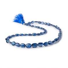 Blue Kyanite faceted oval shaped nugget beads are highly brilliant with a vitreous luster. These Kyanite beads have a good polish on the symmetrical shape exhibiting a silvery sheen within the transparent gems. These blue Kyanite beads are well matched for their deep color and quality with slight internal characteristics. These Kyanite gems are a dark indigo blue throughout the strand. Blue Faceted Oval Beads Jewelry, Silver Faceted Round Beads Gemstones, Faceted Oval Beads For Jewelry Making, Spiritual Oval Gemstone Beads, Blue Kyanite, Dark Indigo, Deep Colors, Indigo Blue, Metal Beads