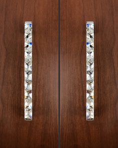 a pair of door handles with crystal stones on the front and side panels inlays