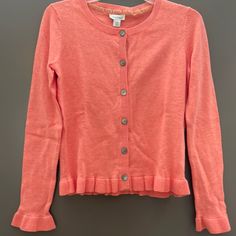 Coral Colored Cardigan In 100% Cotton. New With Tags From Sundance. Fitted Long Sleeve Ruffle Cardigan, Pink Casual Cardigan With Ruffles, Pink Ruffled Cardigan For Spring, Casual Pink Cardigan With Ruffles, Pink Ruffled Cardigan For Fall, Casual Pink Ruffled Cardigan, Fitted Casual Sweater With Ruffles, Casual Fitted Sweater With Ruffles, Pink Long Sleeve Cardigan With Ruffles