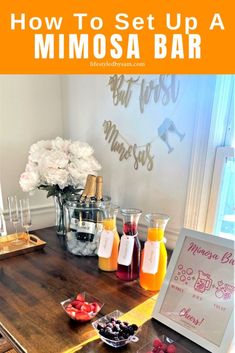 a wooden table topped with fruit and drinks next to a sign that says how to set up a mimosa bar