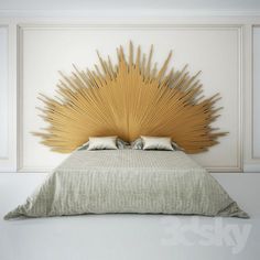 a bed with a large golden headboard on it's side in a white room