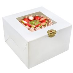 a white box with strawberries in it