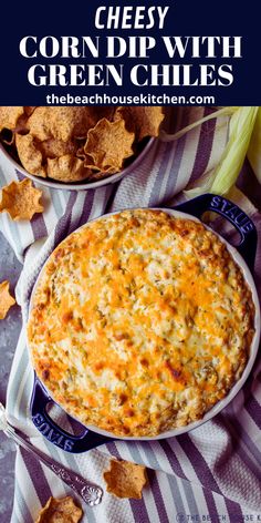 cheesy corn dip with green chiles in a blue and white dish