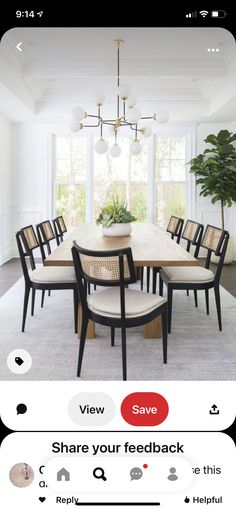 a dining room table with chairs and a plant in the center, on an instagram page