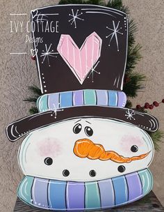 a snowman with a top hat and mustache