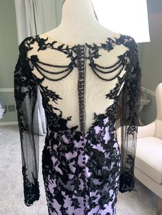 the back of a dress on display in a room