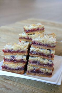 a stack of strawberry shortbreads sitting on top of a white plate