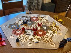 a board game is set up on a dining room table