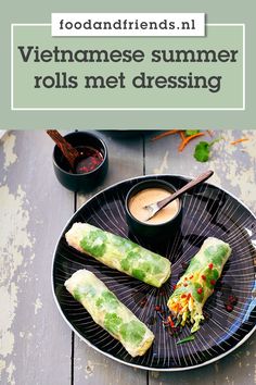 vietnamese summer rolls met dressing on a plate with dipping sauce