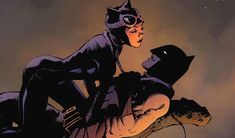 a catwoman sitting on top of a man in a black suit and hat, with the sky behind her