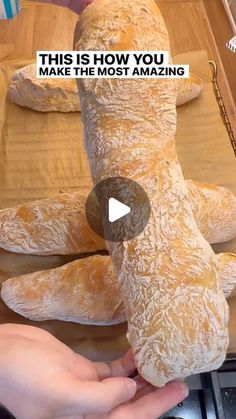 someone is making a stuffed animal out of bread