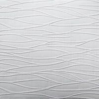 a white pillow with wavy lines on it