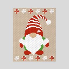 a cross stitch christmas card with an image of a santa clause holding a candy cane