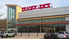 a trader joe's store with cars parked in front