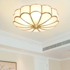 a living room with a large chandelier hanging from the ceiling