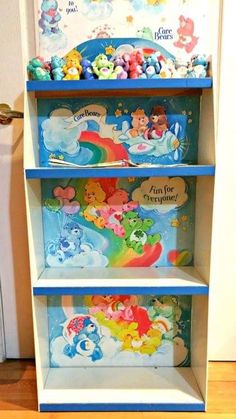 the children's bookshelf is painted with rainbows and pooh bears