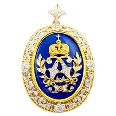 Lapiz Lazuli 26.79 carats and Diamond 1.11 carats Brooch/Pendant set in 18K Gold Settings Width: 4.8 cm Length: 6.0 cm Total Weight: 26.24 grams "We first opened doors in 1980 when it was then situated in the vicinity of the Victory Monument; a small and modest storefront with a couple of counters. From its humble beginnings to where it stands today, our company has proven its abilities as a jeweler. Since the beginning, we have been supplying fine quality pieces to dealers, wholesalers and cust Humble Beginnings, Thai Art, Diamond Brooch, Art Deco Diamond, Pendant Set, Monument, 18k Gold, Art Deco, Pendant