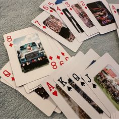 playing cards are laid out on the floor with numbers and pictures in front of them