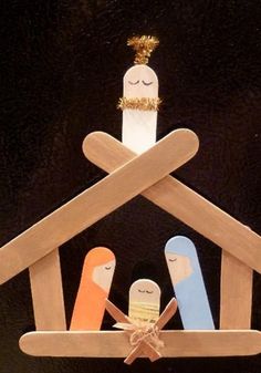 the nativity scene is made out of popsicle sticks