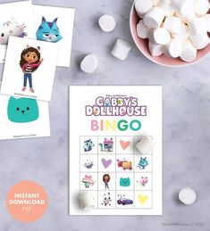 the printable baby's dollhouse bingo game is next to marshmallows