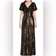 Add An Elegant Charm To Your Party Look By Wearing Alex Evenings Long Sequins Gown With Flutter Sleeves And Front Knot Detail. The Long Sequin Gowns Have Flutter Sleeves And Front Twist Detail. A V-Neckline, Back-Zipper Closure, And Maxi-Length Make It Convenient To Style. A-Line Silhouette. 97% Polyester, 3% Spandex. Dry Clean Only. Imported. Brown Short Sleeve Maxi Dress For Party, Short Sleeve Brown Dress For Evening, Brown Short Sleeve Dress For Evening, Sequin Gowns, Sequins Gown, Alex Evenings, Sequin Gown, Party Look, Party Looks