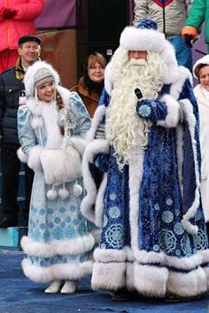 people dressed up as santa claus and snowmen