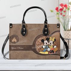 Mickey and minnie Leather Handbag,Mickey Women Bags Purses,Mickey Lover's Handbag,Custom Leather Bag,Woman Handbag,Handmade Bag,Vintage Bag Product Information: Manufactured with premium water-resistant PU leather. Size: ~11.4*7.9*4.1in (29*20*10.5 cm). Features comfortable and sturdy ~29in (74cm)carrying straps, two handles~14,5in (37cm) high-quality stitching for long-lasting durability. Perfect for dating, shopping, working, traveling, vocation, party and other occasions. Well made of high quality metal buckle. Detailed stitching with smoothly metal buckle. Handbags have 1 main compartment, and one side pocket - you can use it for an extra pocket. This handbag can hold your iPad, wallet, makeup, phone, little water bottle, perfumes, gloves, and other everyday items and keep them organiz Leather Bag Women Handbags, Custom Leather Bag, Woman Handbag, Vintage Bag, Handmade Bag, Leather Bag Women, Timeless Accessories, Bag Vintage, Bags Purses