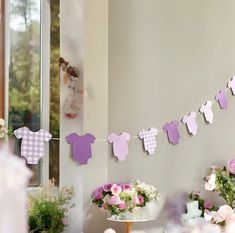 a baby's first birthday party with pink and purple decorations